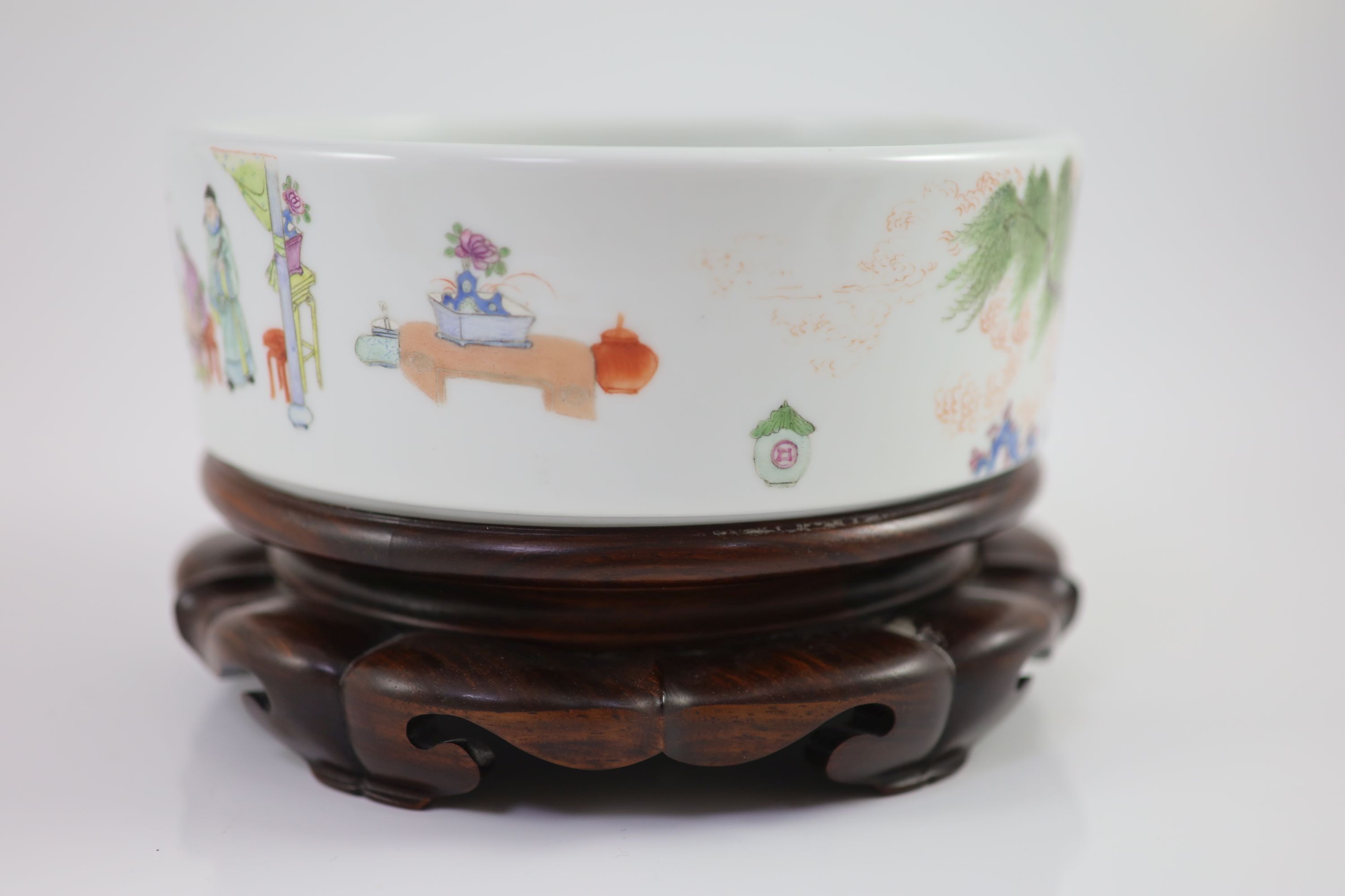 A Chinese famille rose cylindrical bowl, Yongzheng mark but Republic period, 19cm diameter, 7cm high, wood stand